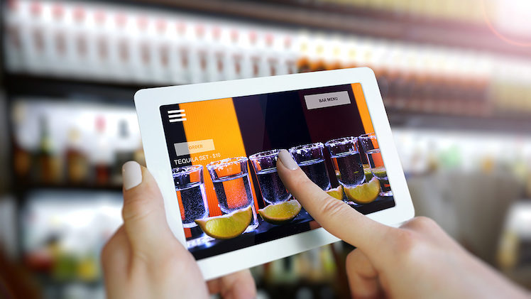 Customer use AR application to order drink at the bar,