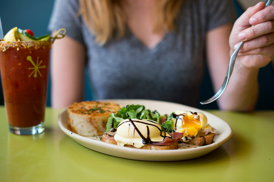 The Bella! Bella! Benny take on Eggs Benedict is thin slices of prosciutto, Taleggio cheese, and poached cage-free eggs on toasted ciabatta, topped with cream cheese hollandaise, balsamic glaze and arugula.