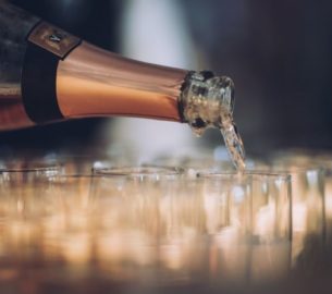 Champagne pouring into flute glasses