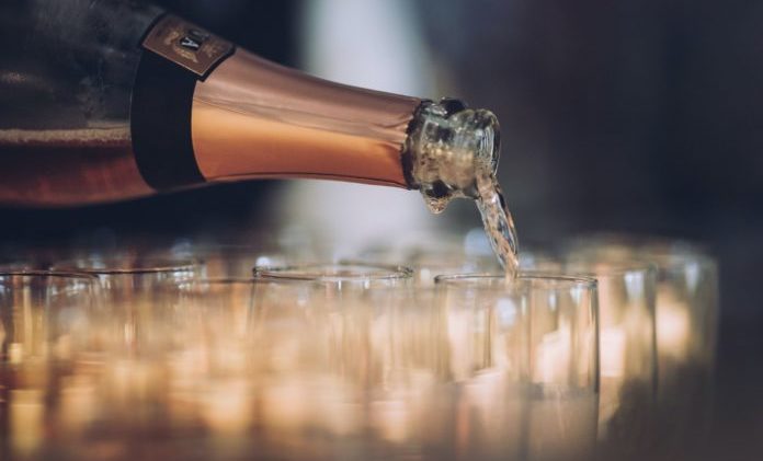 Champagne pouring into flute glasses