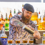 JWU student Chris Spielhagen mixes up the Boston Stone cocktail