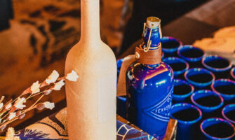 sotol bottle and blue porcelain tumblers
