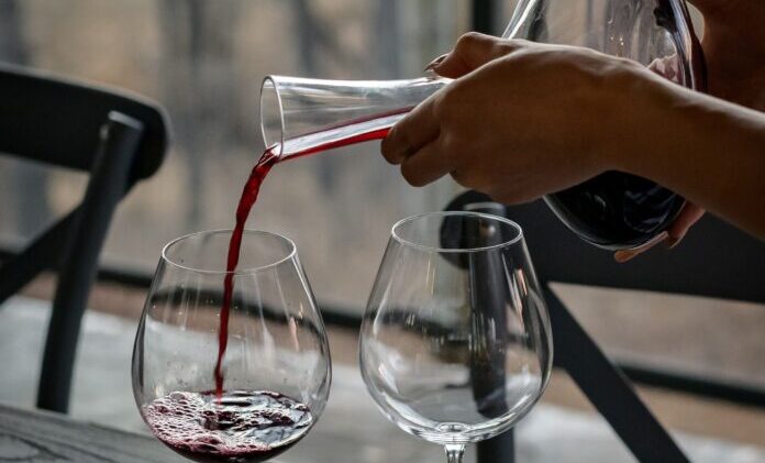 red wine poured from a decanter
