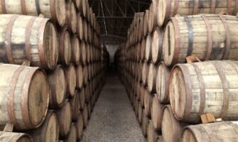 whiskey barrels in warehouse