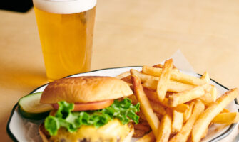 a draft beer, burger and fries