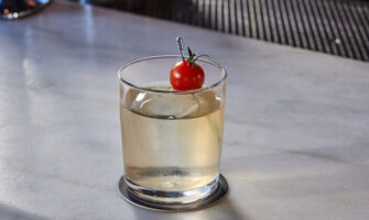 Wavelength cocktail with cherry tomato garnish