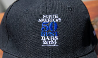 black hat with the 50 Best Bars logo