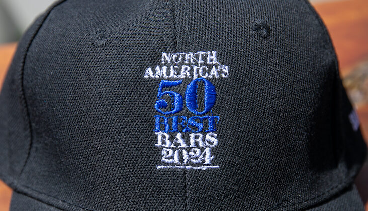 black hat with the 50 Best Bars logo