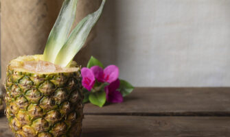 a Piña Colada cocktail served in pineapple half