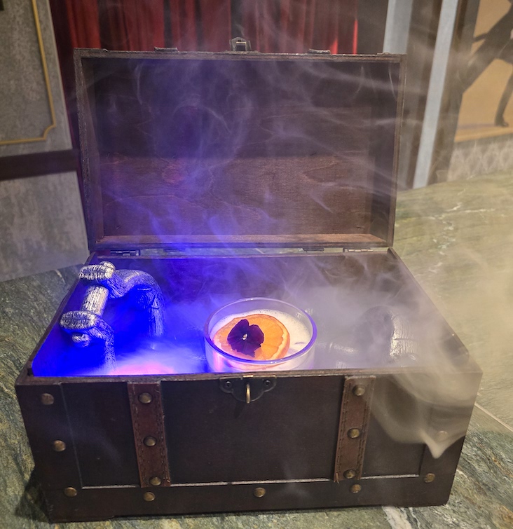 Escape From Houdini’s Chest cocktail in a smoking chest